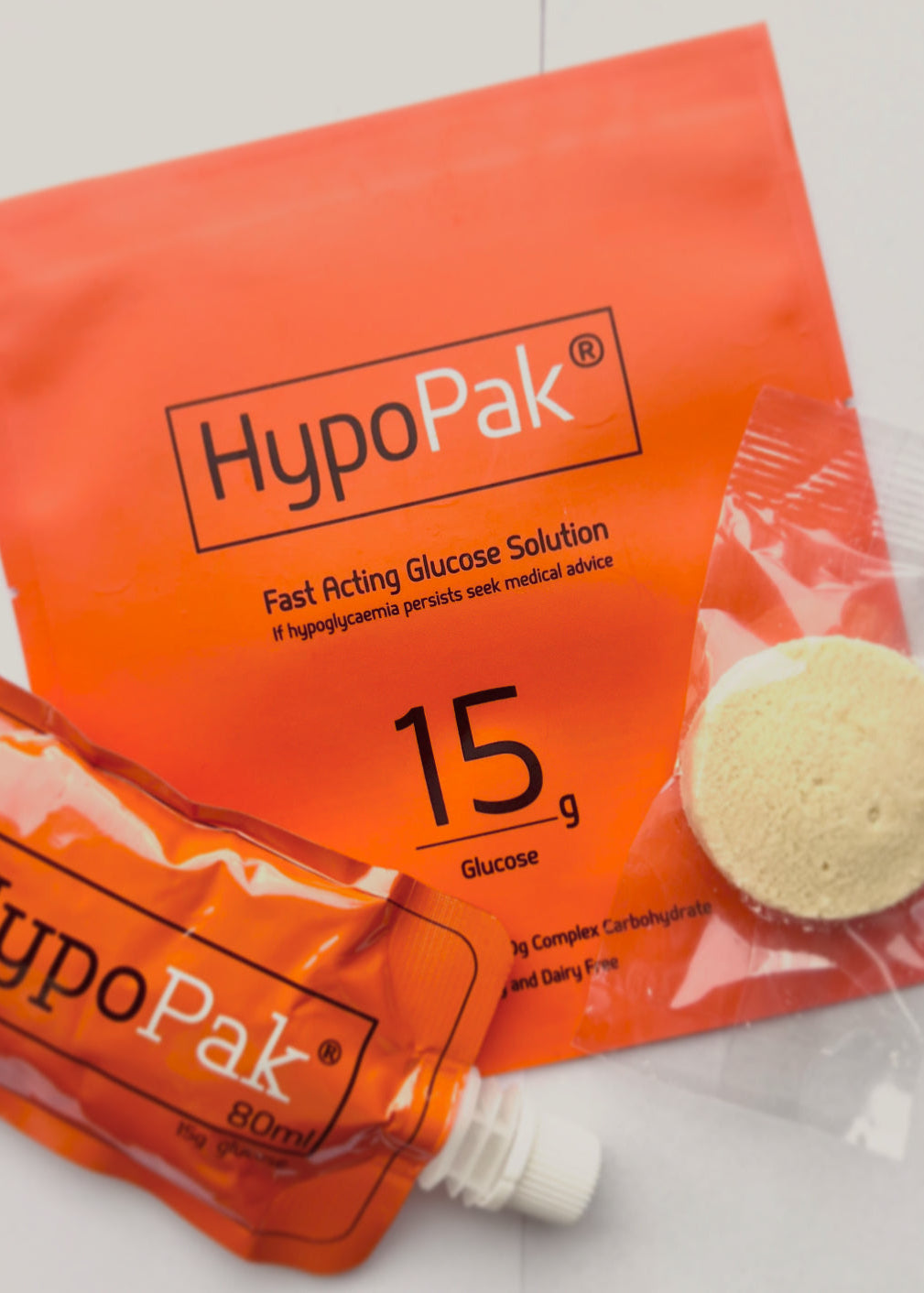 Two HypoPak glucose solution packets on a white background